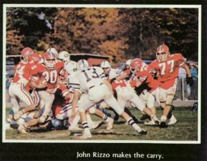 1987_10_24 Homecoming 30 John Rizzo runs the ball with 77 Aaron Day